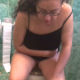 A woman wearing glasses sits down on a toilet, moans and groans with a little bit of over-acting, and then takes a large shit that comes out with a noisy, heavy plop. Poop action is visible between her legs. Some pissing, too. 720P HD. About 2.5 minutes.